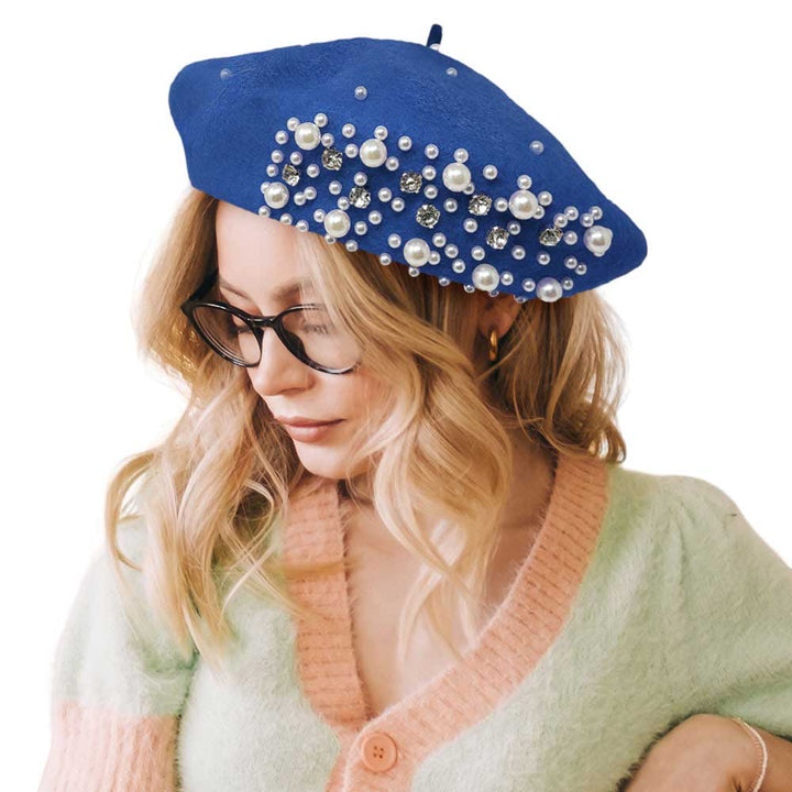 Blue Pearl Stone Embellished Solid Beret Hat, this timeless pearl stone beret hat is a luxurious accessory for any wardrobe. Crafted from a quality fabric, it's adorned with shimmering pearl stones that will add a touch of opulence to any outfit. Perfect gift item for Birthdays, Christmas, Secret Santa, and anniversaries.