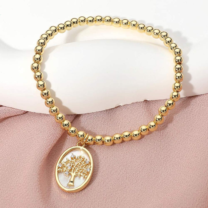Gold, Mother of Pearl Stainless Steel Tree of Life Embossed Mother of Pearl Oval Charm Beaded Stretch Bracelet