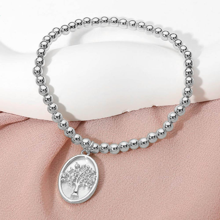Mother of Pearl, Silver Stainless Steel Tree of Life Embossed Mother of Pearl Oval Charm Beaded Stretch Bracelet