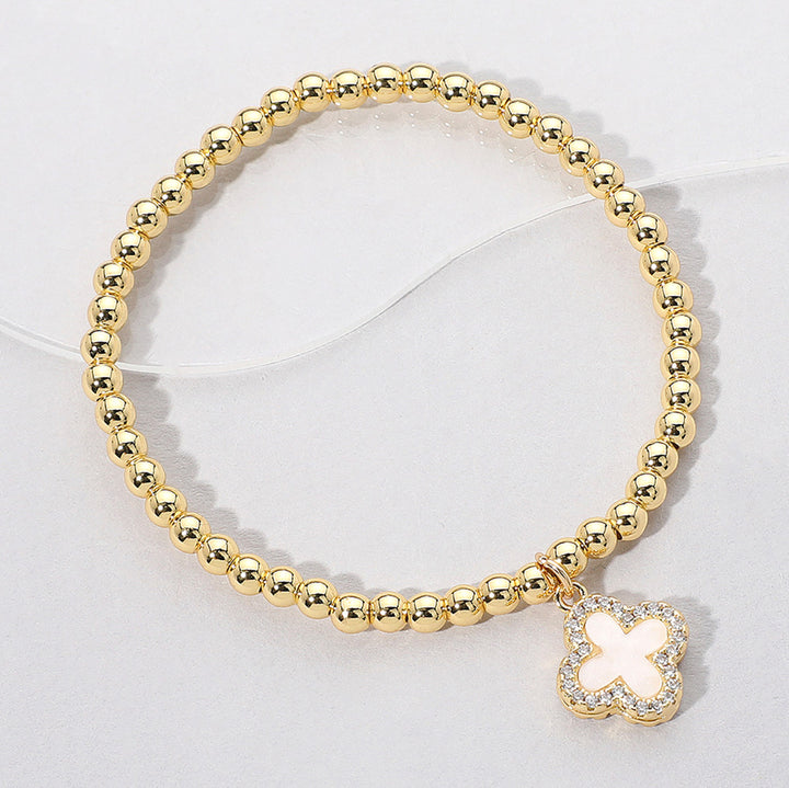 Gold, Mother of Pearl Reversible Stainless Steel Quatrefoil Charm Beaded Stretch Bracelet