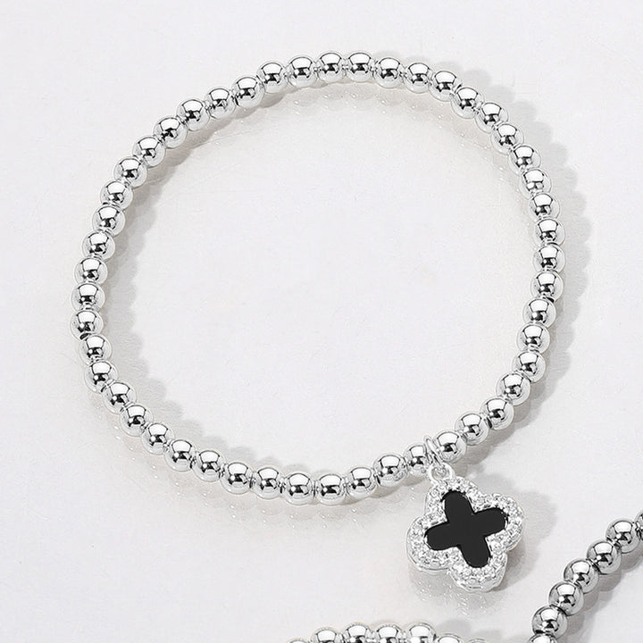 Black, Silver Reversible Stainless Steel Quatrefoil Charm Beaded Stretch Bracelet