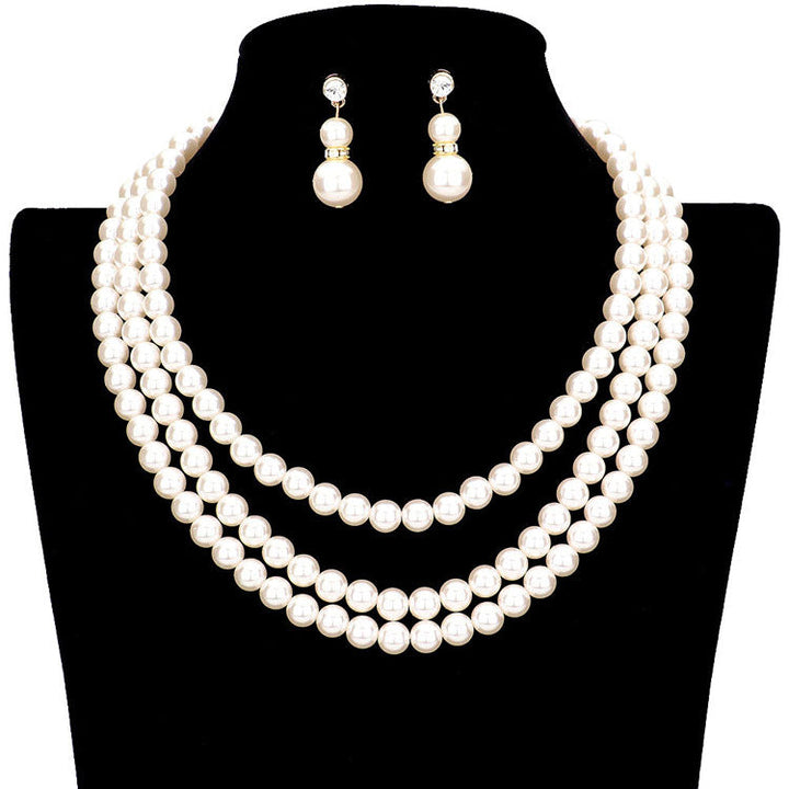 Cream Gold Layered Multi Sized Pearl Bead Bib Necklace, designed to accent the neckline, which are a perfect way to add sparkle to everything, showing off your elegance, stunning jewelry set will sparkle all night long making you shine like a diamond. perfect for a night out on the town or a black tie party. Wear together or separate according to your event, the perfect addition to every outfit. Adds a touch of beautiful inspired beauty to your look.