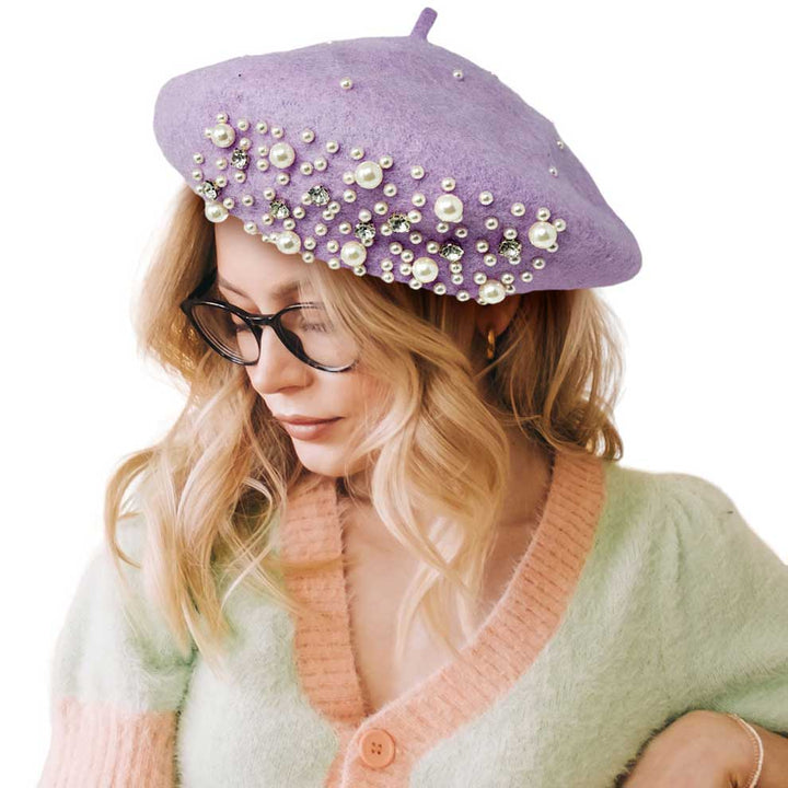 Lavender Pearl Stone Embellished Solid Beret Hat, this timeless pearl stone beret hat is a luxurious accessory for any wardrobe. Crafted from a quality fabric, it's adorned with shimmering pearl stones that will add a touch of opulence to any outfit. Perfect gift item for Birthdays, Christmas, Secret Santa, and anniversaries.
