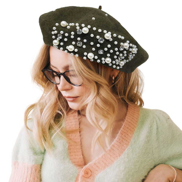 Olive Green Pearl Stone Embellished Solid Beret Hat, this timeless pearl stone beret hat is a luxurious accessory for any wardrobe. Crafted from a quality fabric, it's adorned with shimmering pearl stones that will add a touch of opulence to any outfit. Perfect gift item for Birthdays, Christmas, Secret Santa, and anniversaries.