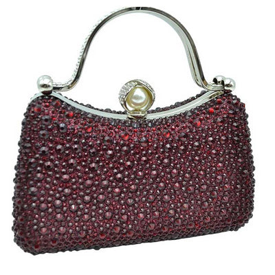 Red Crystal Diamond Top Handle Embellished Evening Clutch Bag is a remarkable evening bag, crafted from premium materials with a crystal diamond top handle for a special touch. Featuring a soft-textured fabric lining and a stylish, elegant exterior, this clutch bag is ideal for special occasions.