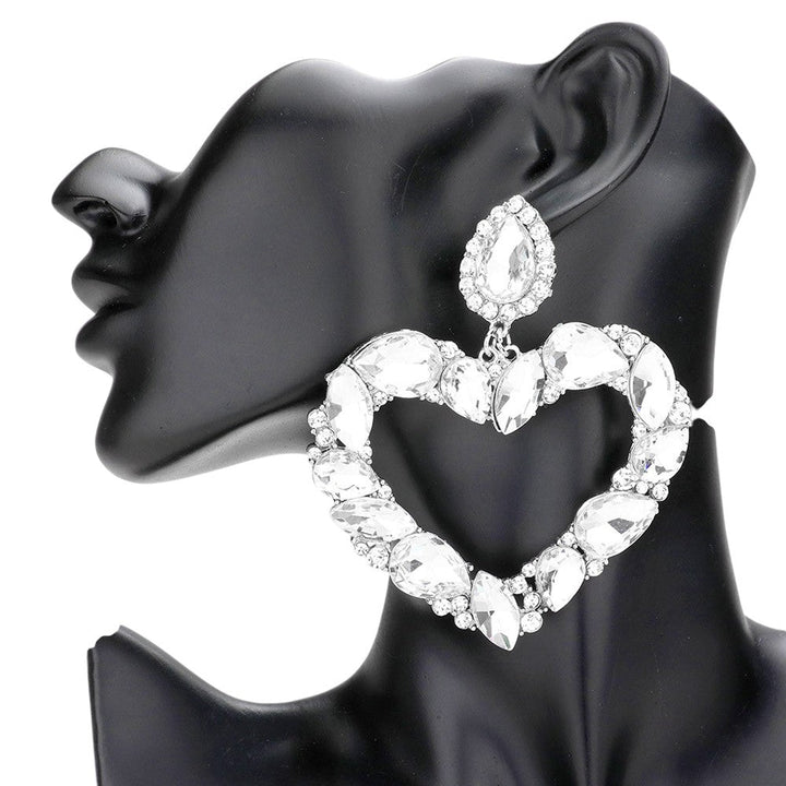 Rhodium Marquise Teardrop Stone Cluster Open Heart Dangle Evening Earrings are a stunning addition to any outfit. The unique design and elegant shape of the earrings make them perfect for a special evening event. With a beautiful open heart dangle and sparkling teardrop stones, they are sure to make a statement and elevate your style.