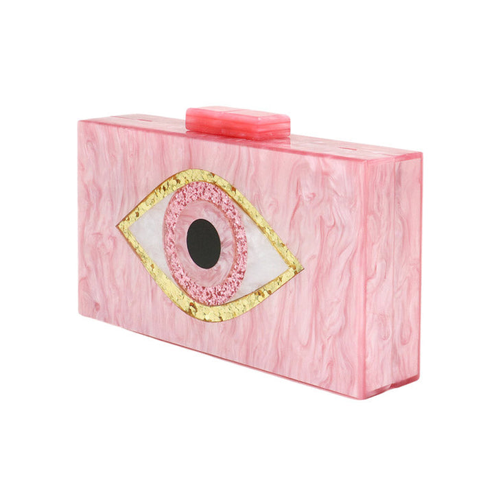 This Glittered Evil Eye Celluloid Acetate Clutch Crossbody Bag will make you the star of the show! This eye-catching bag is studded with glitter, and is made with durable celluloid acetate to last you a lifetime. Perfect gift ideas for a birthday, Christmas, anniversary, Valentine's Day, or any special occasion.